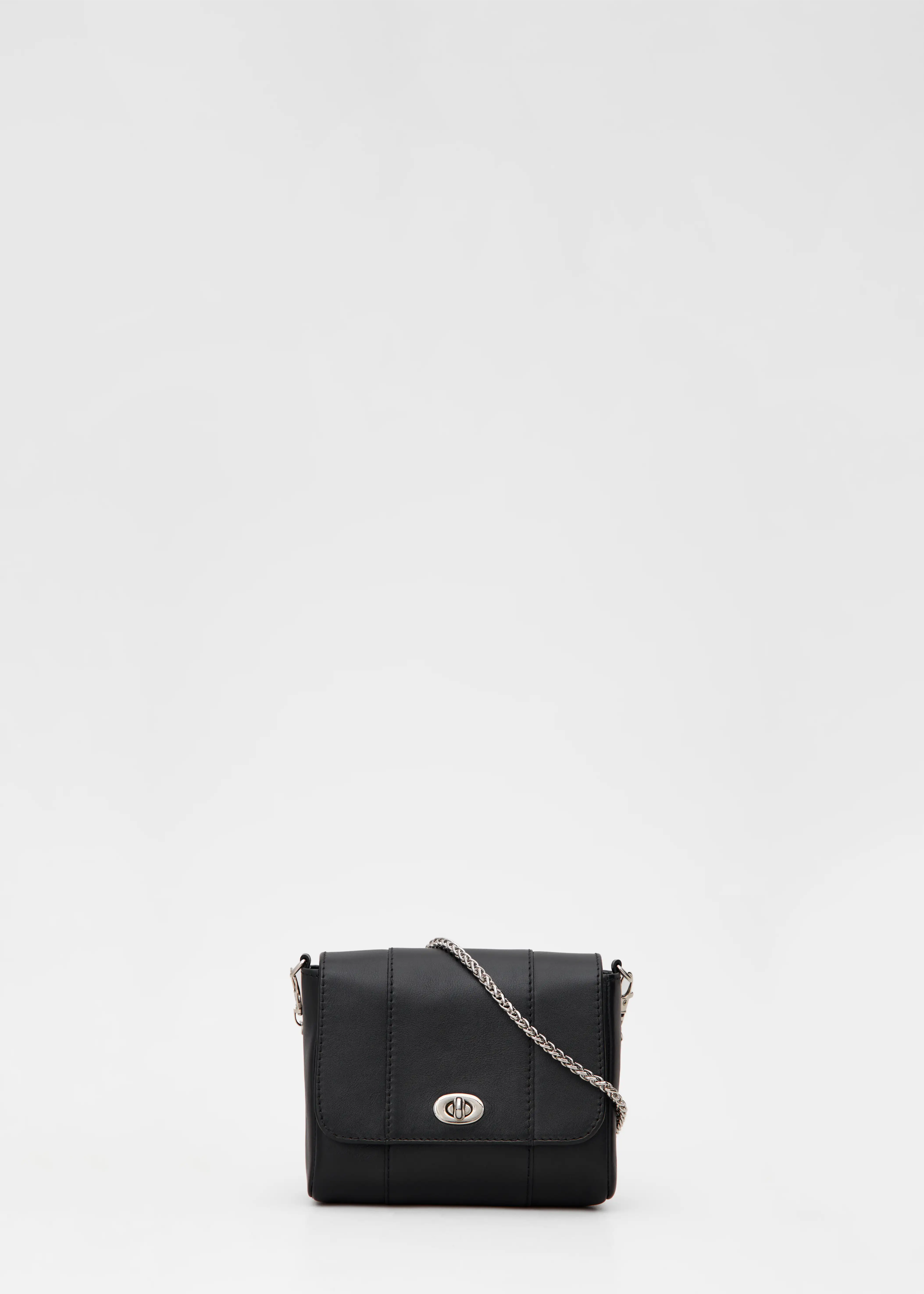 Front view of the Philini Marina Mini Crossbody Bag in black calf leather, rectangular shape with front flap, silver clasp, and silver chain shoulder strap. Elegant mini leather shoulder bag