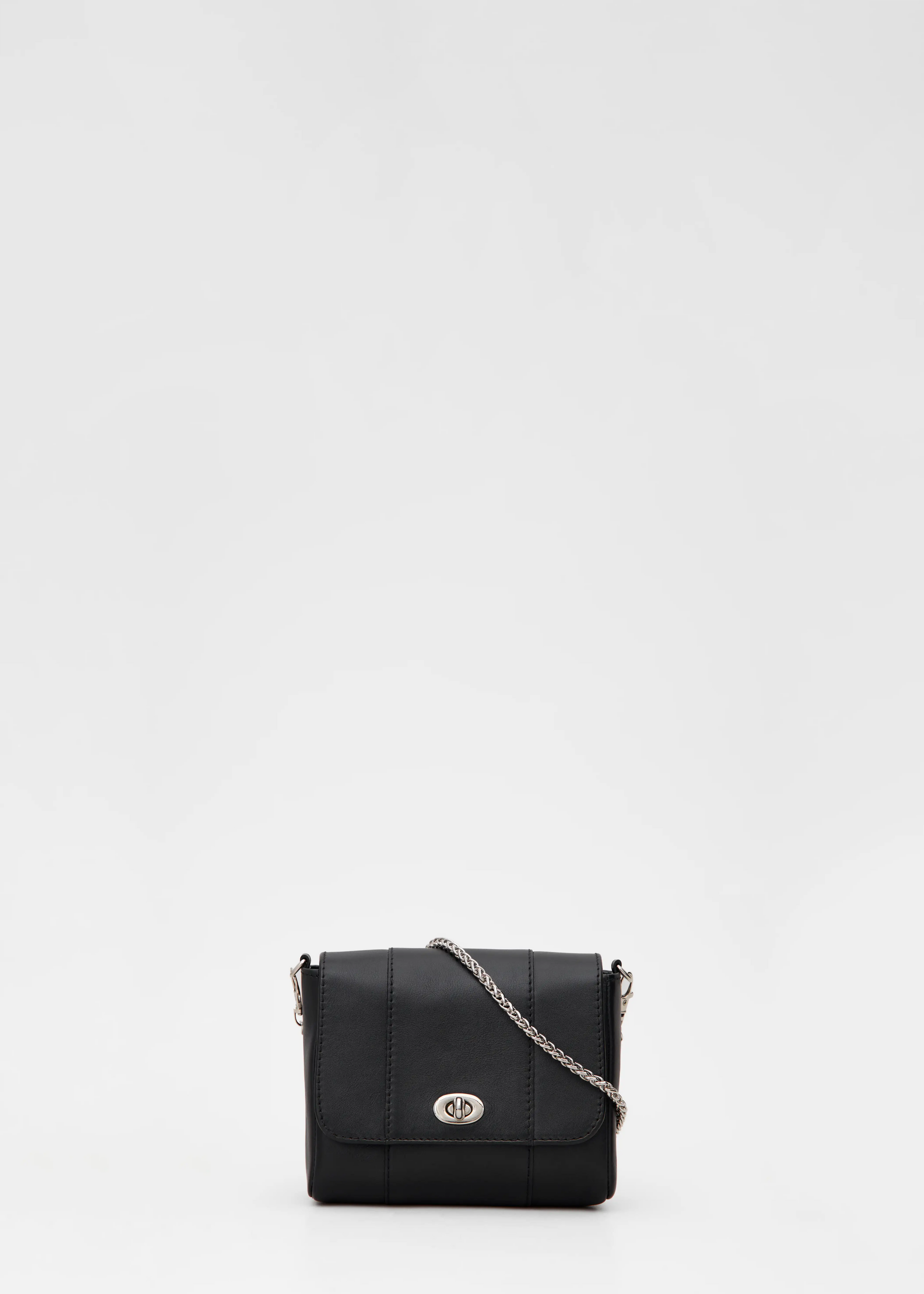 Front view of the Philini Marina Mini Crossbody Bag in black calf leather, rectangular shape with front flap, silver clasp, and silver chain shoulder strap. Elegant mini leather shoulder bag