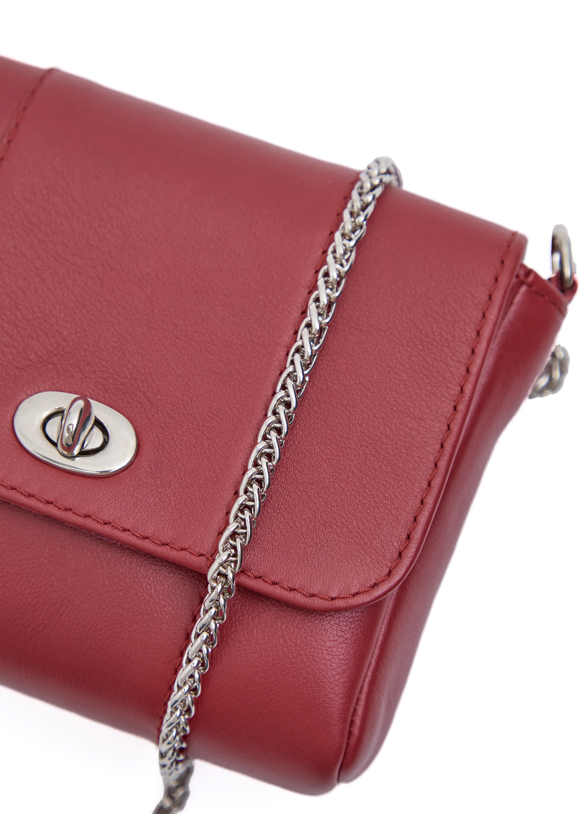 Close front view of the Philini Marina Mini Crossbody Bag in red nappa leather, showing front flap with silver clasp, silver chain. Compact red leather crossbody bag. 