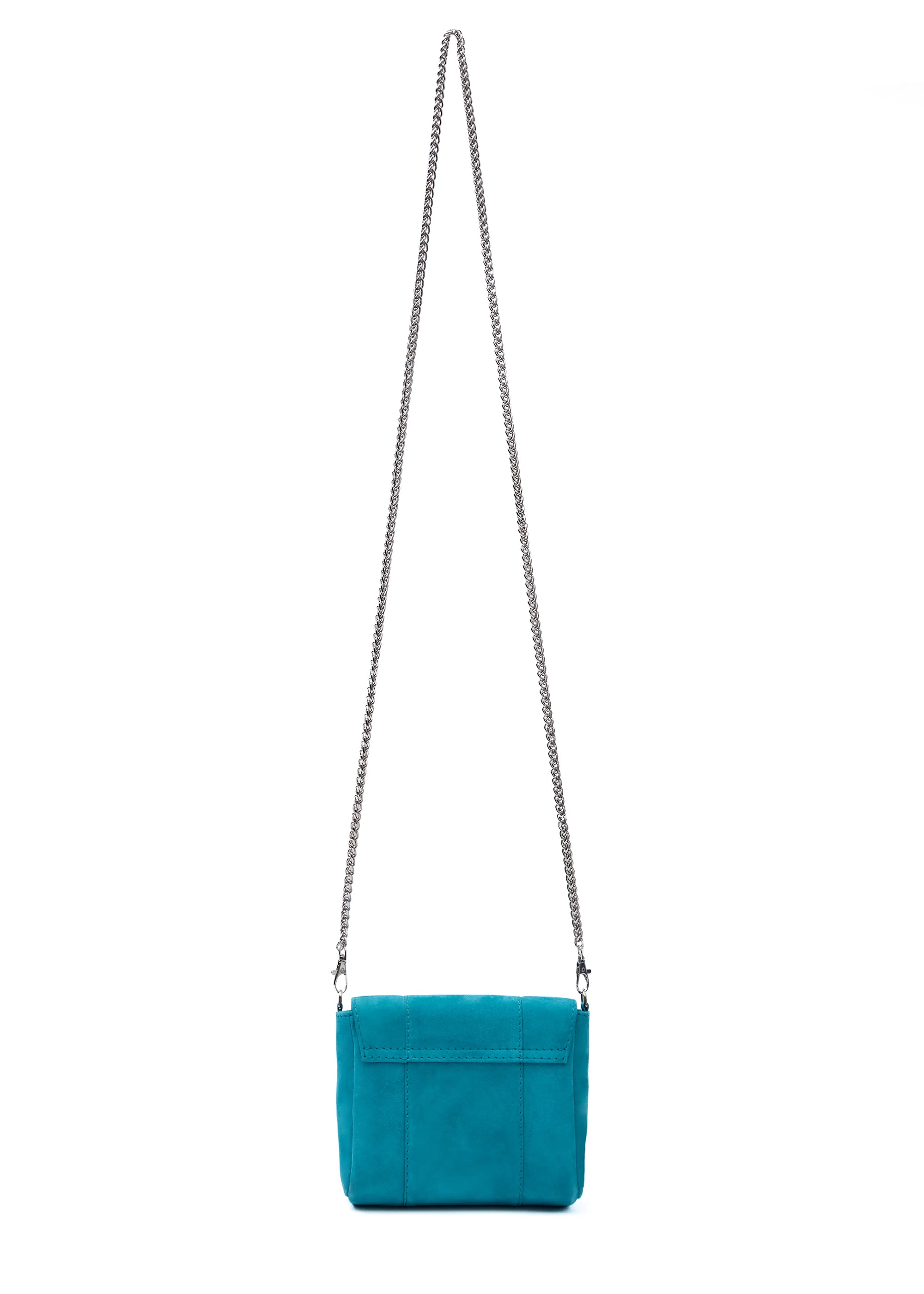 Back view of the Philini Marina Mini Crossbody Bag in turquoise suede leather, rectangular silhouette with front flap and silver chain shoulder strap. Handcrafted suede designer bag 
