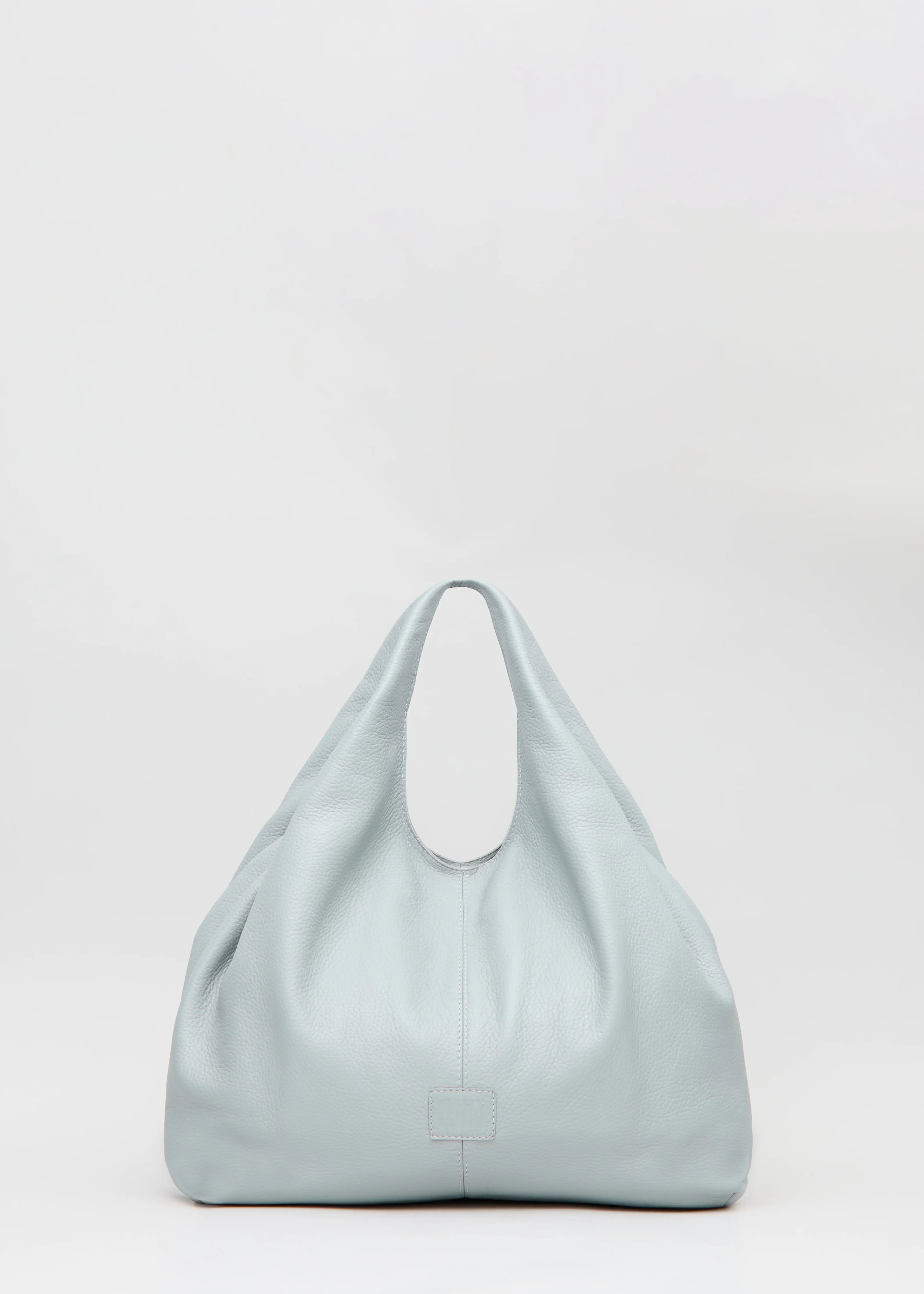 Front view of the Philini Melanie Hobo Bag in grey buffalo leather, featuring two top handles and a stamped logo. Soft full-grain leather shoulder bag, luxury minimalist hobo tote for women.