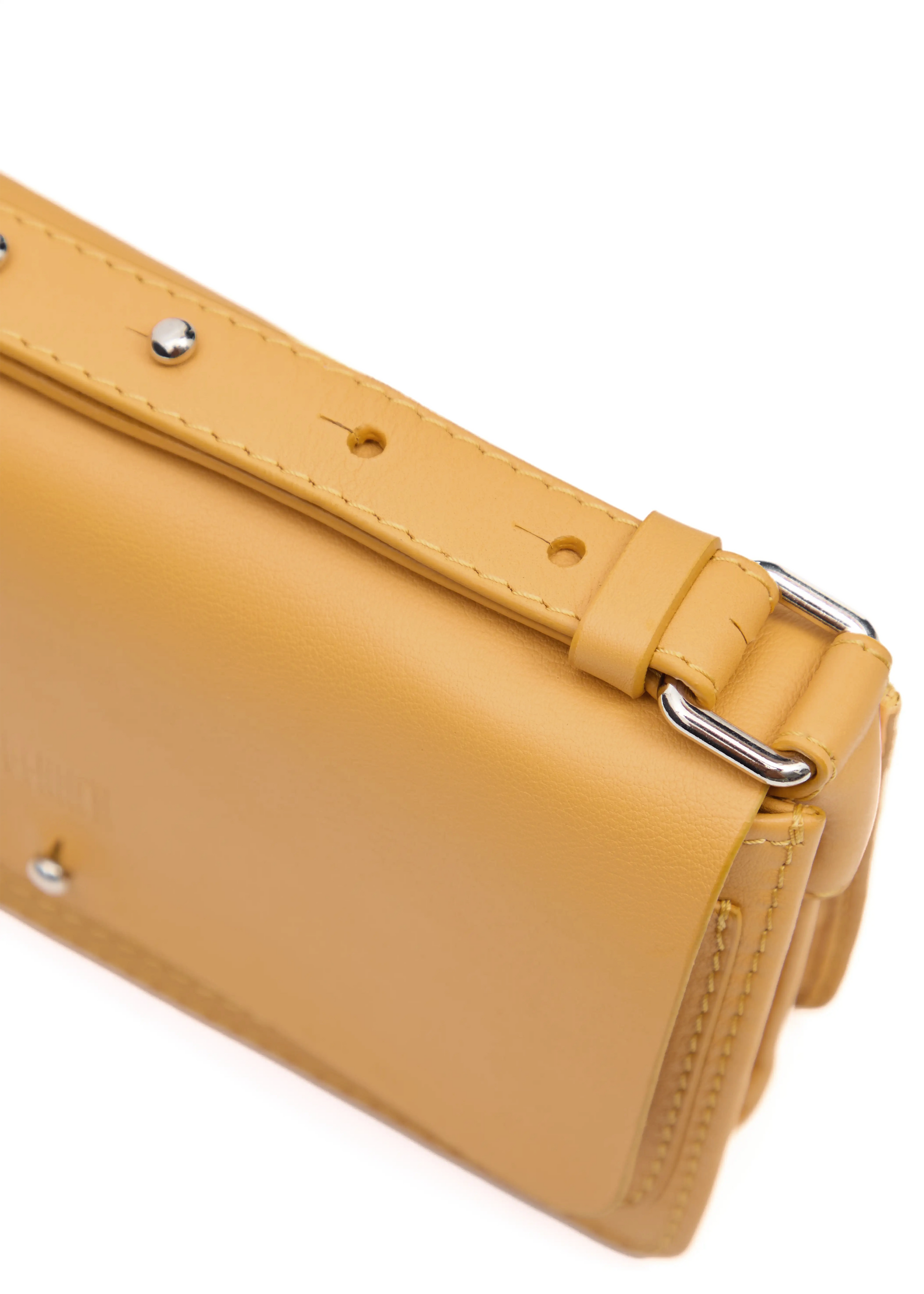 Close-up side view of the yellow Philini Mihaela Wallet Bag in nappa leather, featuring accordion sides, stitched details, silver hardware, and minimalist crossbody design