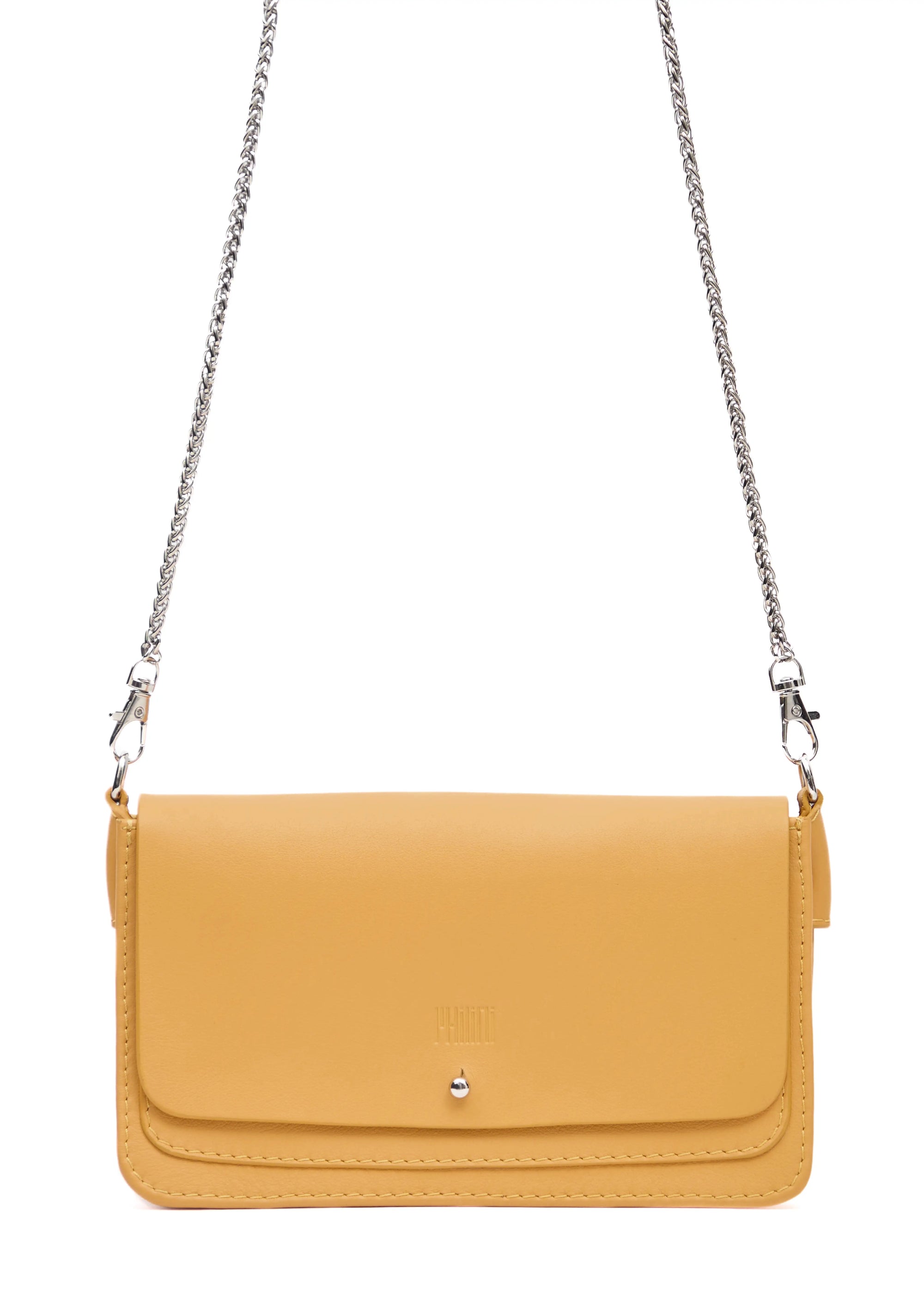Close-up front view of the handcrafted yellow Philini Mihaela Wallet Bag in nappa leather, featuring a tapered rectangular shape, silver cufflink flap closure, stamped logo, and silver chain strap with carabiner details, a compact luxury wallet bag for conscious, minimalist and elegant style