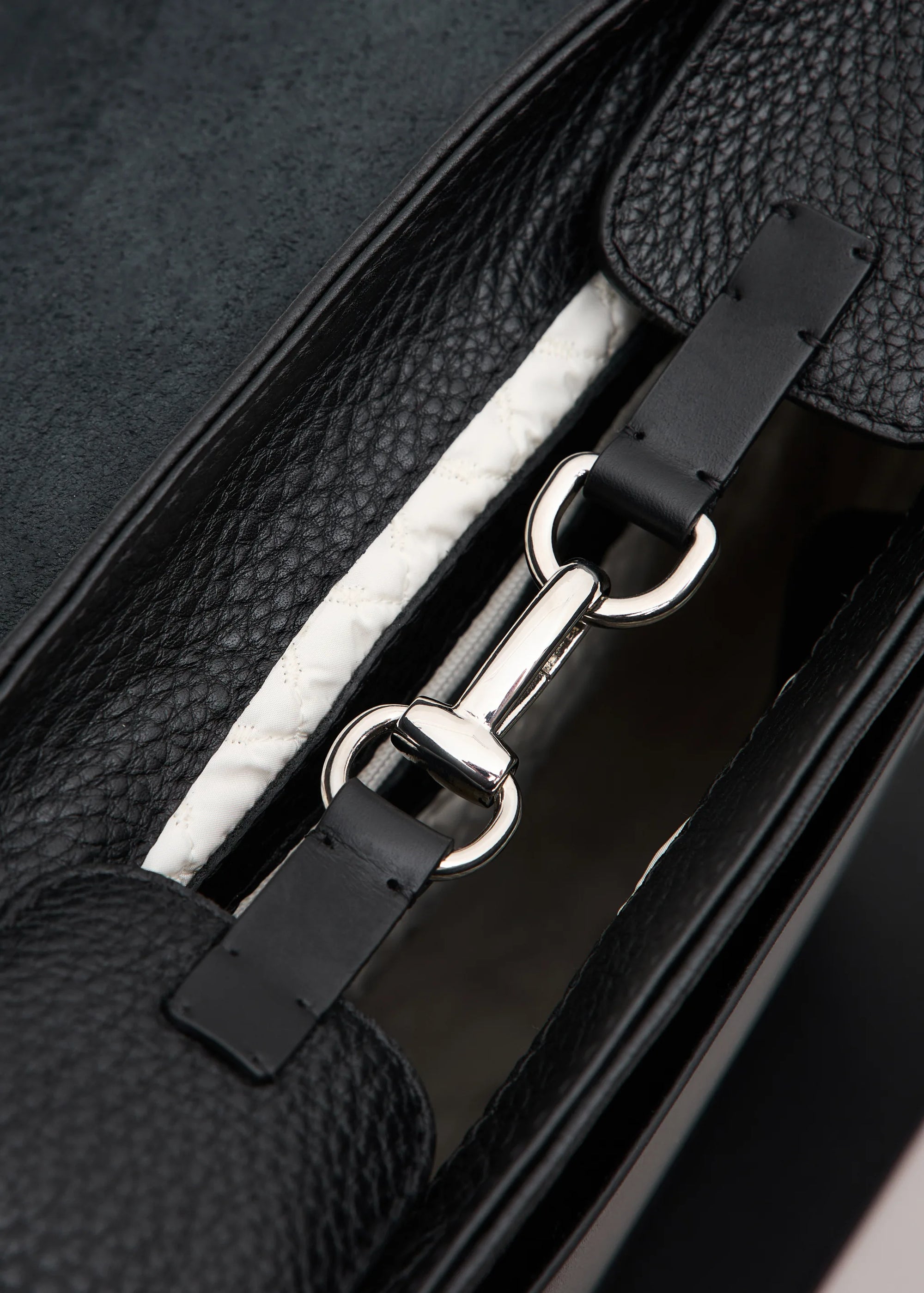 inside view of the Philini Olga Black Leather Messenger Bag, highlighting the rich texture of premium full-grain leather.