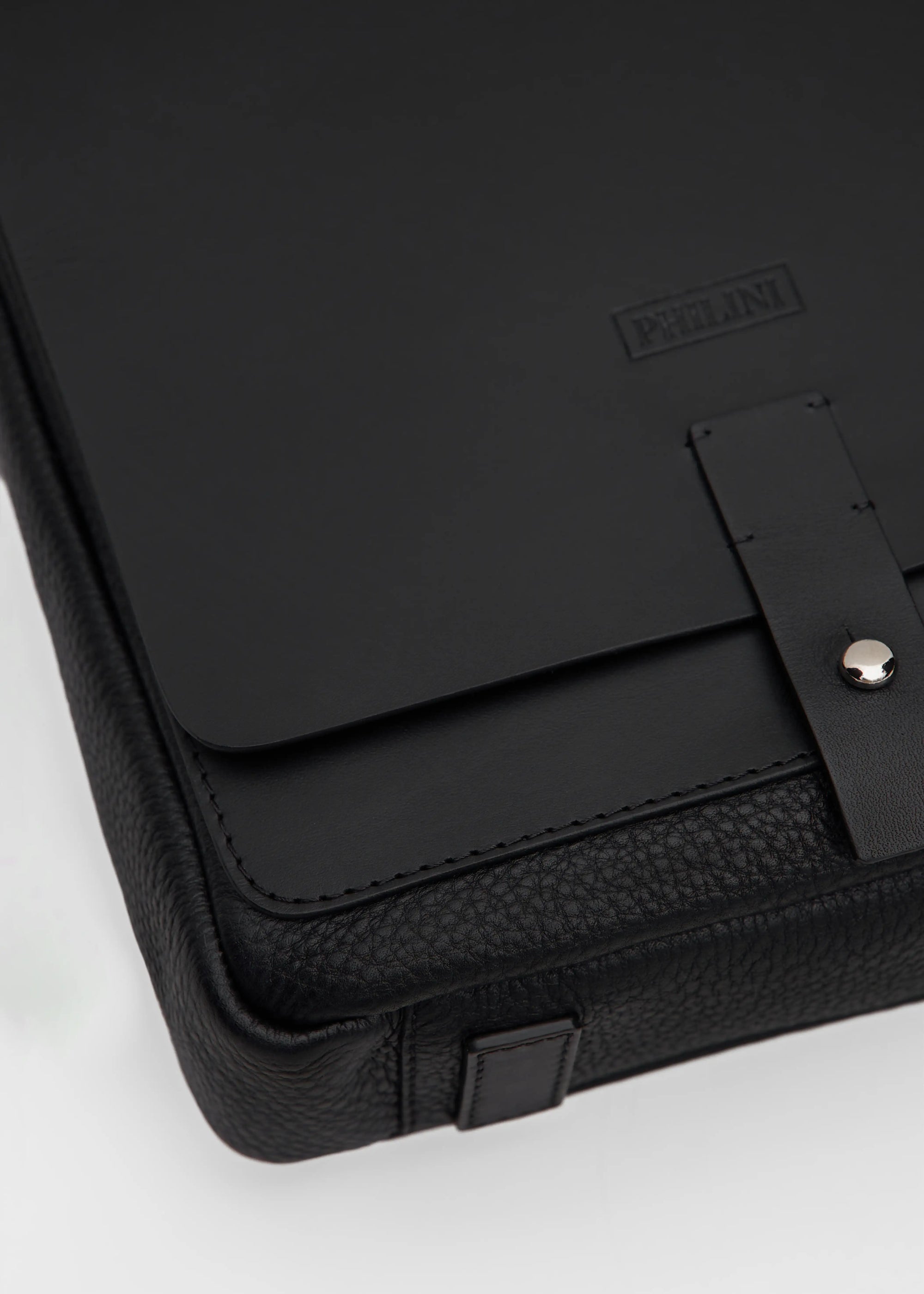 Close-up view of the Philini Olga Black Leather Messenger Bag, highlighting the rich texture of premium full-grain leather.