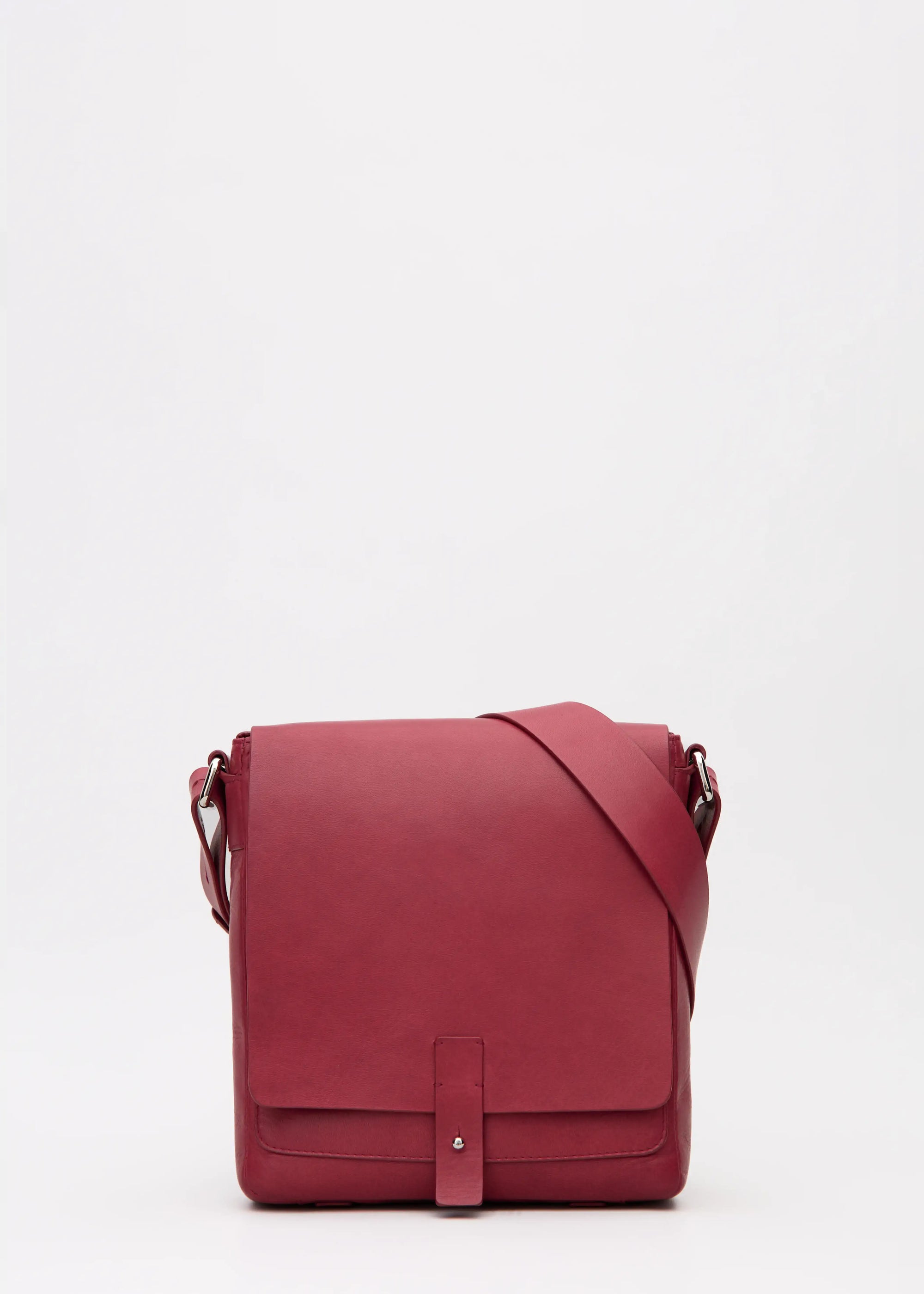 Front view of red aniline nappa leather Philini Olga Postman-style Bag with rectangular shape, silver cufflink closure, and adjustable strap. Elegant handcrafted leather handbag for everyday wear and sustainable fashion