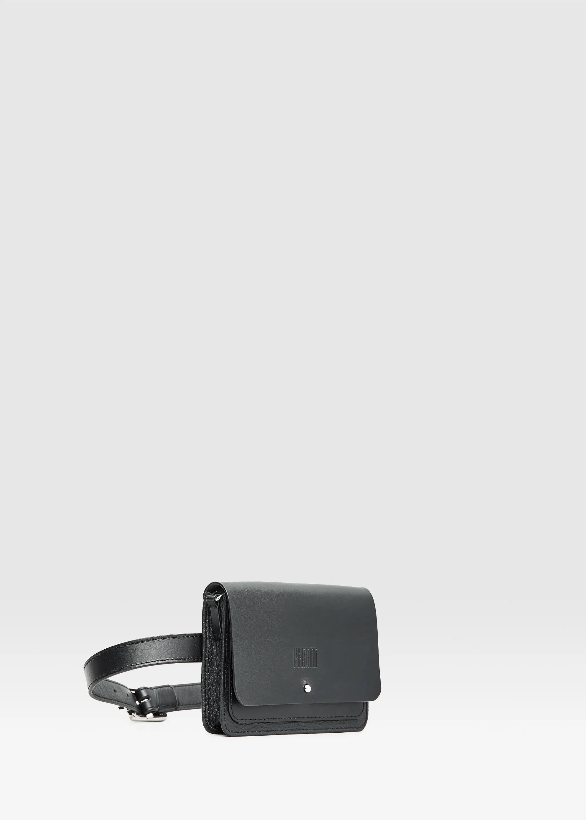 Side angle of the Philini Polina Black Belt Bag,  Features a front flap with a silver cufflink-style