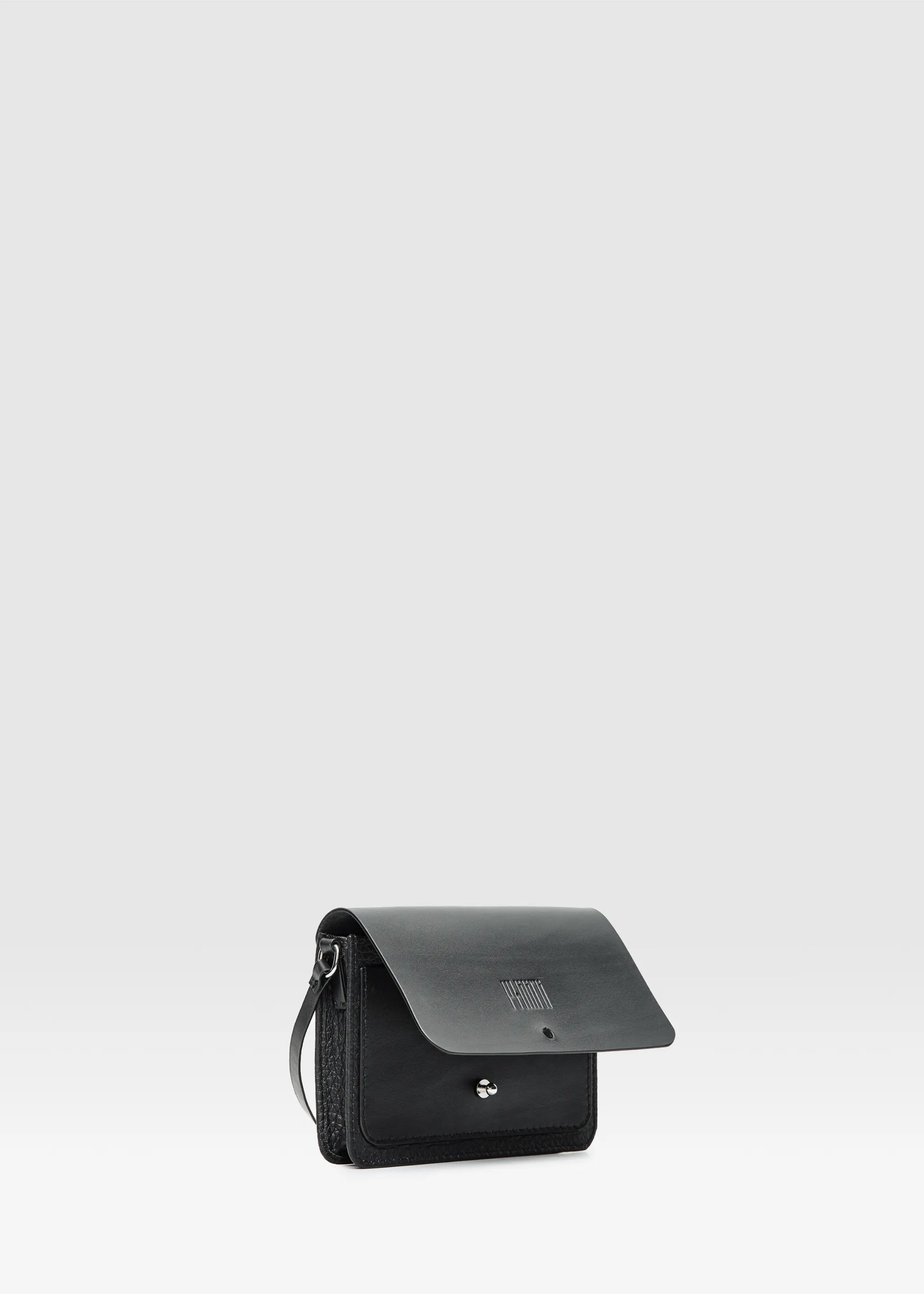 Close-up interior view of the Philini Polina Black Belt Bag, showcasing a dedicated compartment.