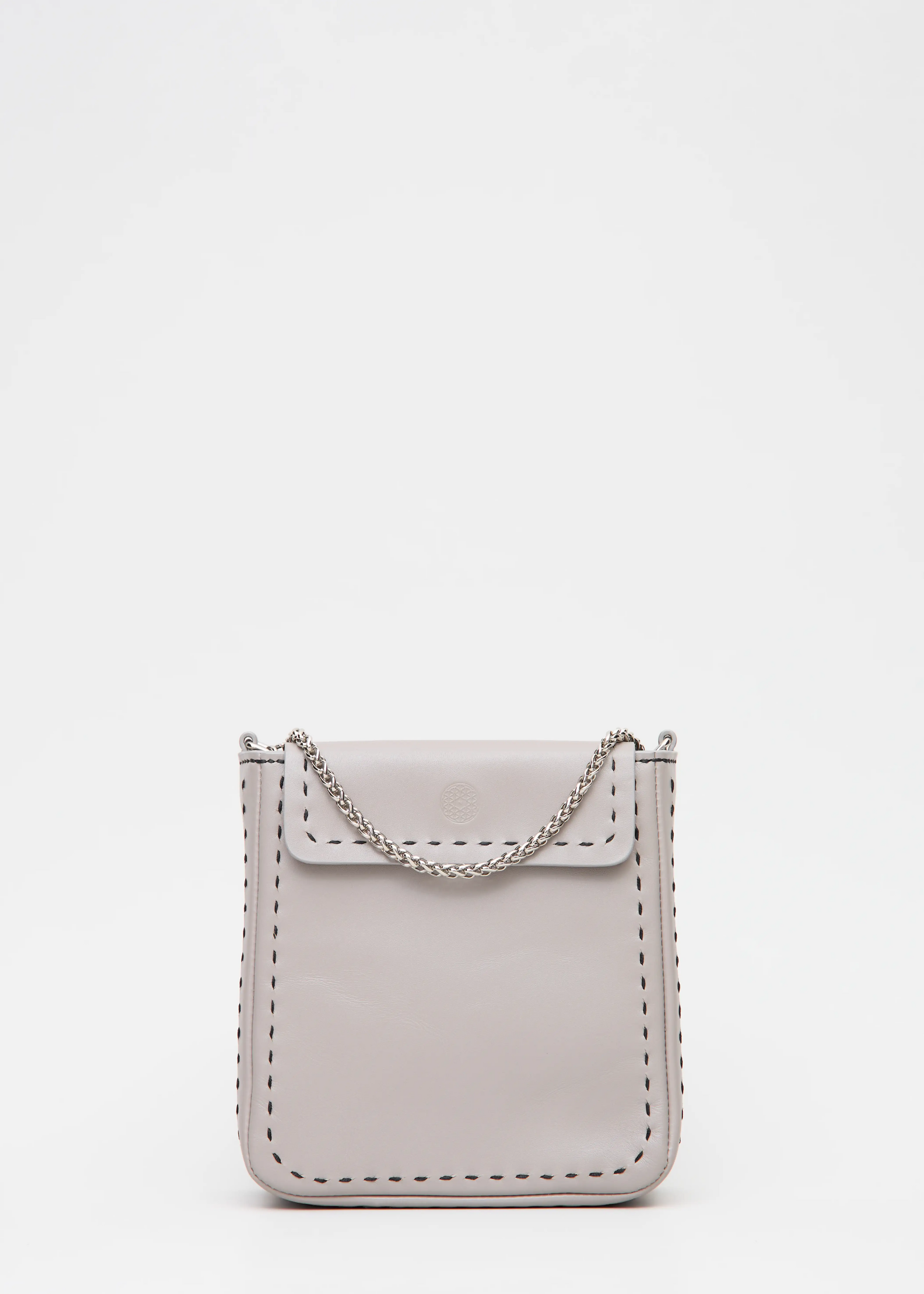 Close front view of the Philini Saphira Purse in taupe aniline leather, compact rectangular shape with hand-stitched details, sleek half-lap flap, and convertible chain and leather straps. Elegant handmade leather evening purse.