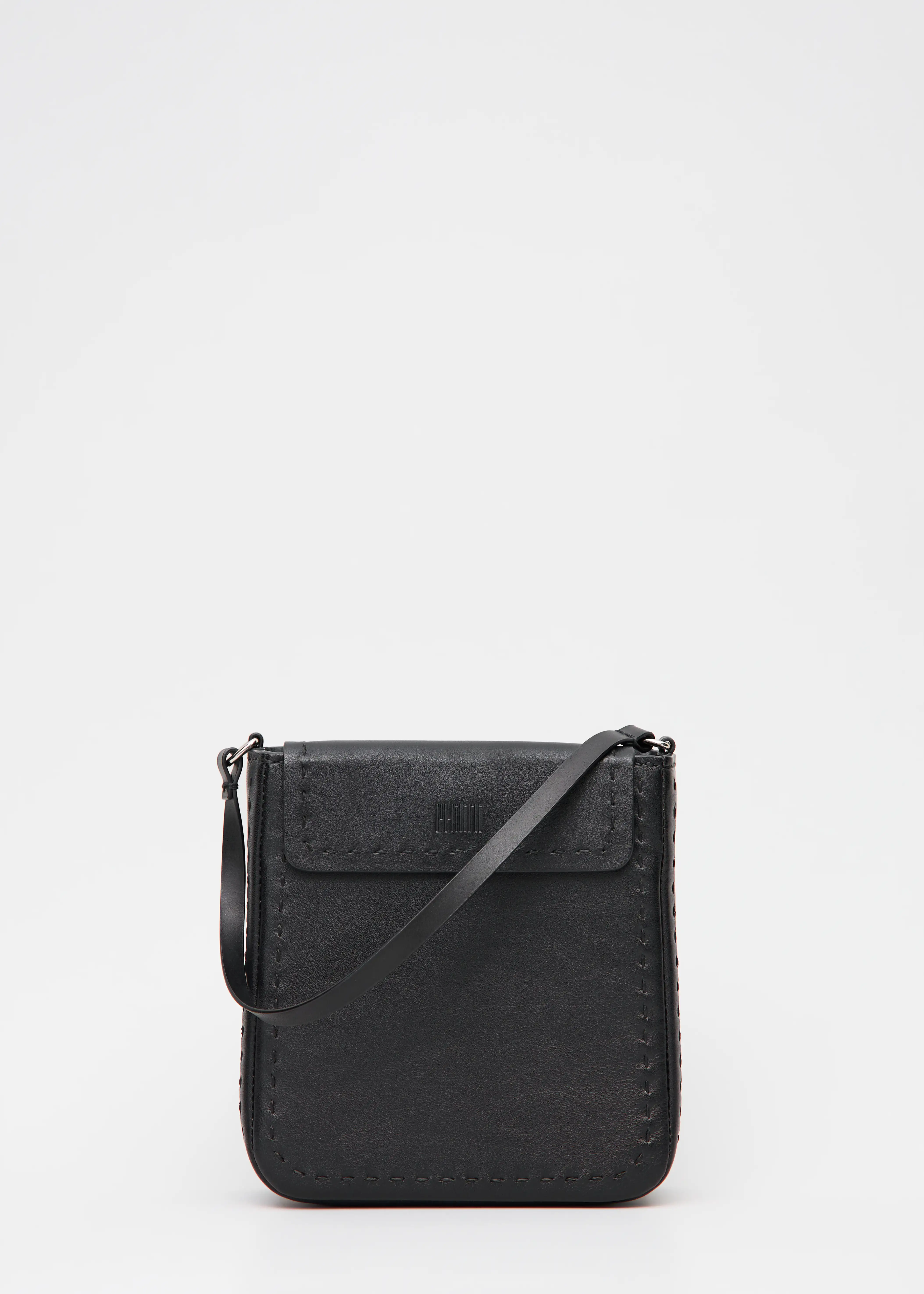 Close front view of the Philini Saphira Purse in black aniline leather, compact rectangular silhouette with hand-stitched accents, smooth half-lap flap, and versatile leather and chain handles. Handmade black leather evening bag.