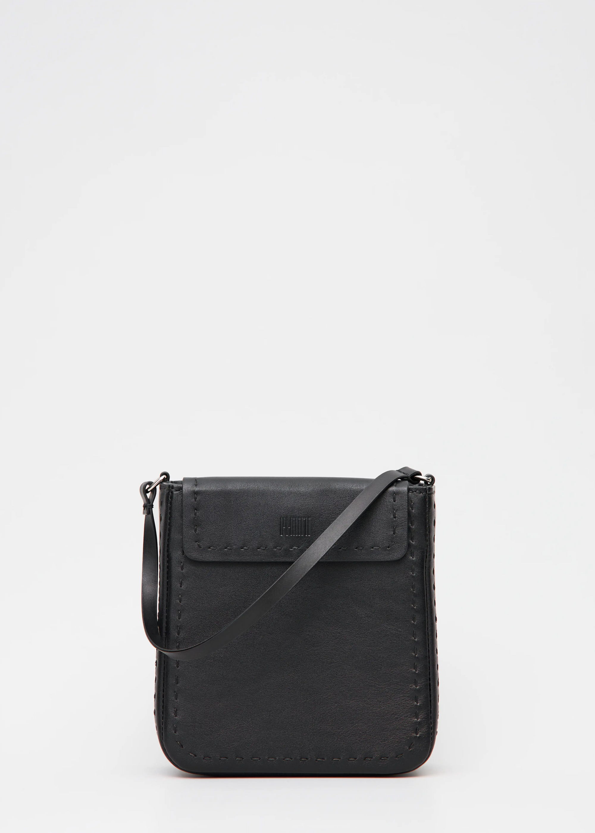 Elegant black handbag combining buffalo & full-grain leather. Features dual zipper compartments, short handles & silver details. Handcrafted by Philini.