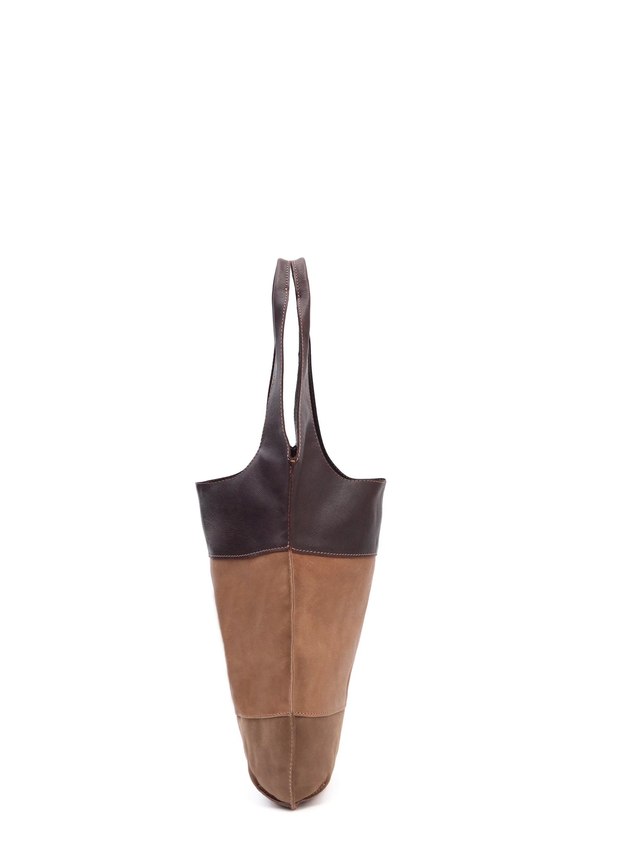 Side view of the Philini Semfira Hobo Bag in brown nubuck and calf leather, highlighting the hand-stitched detailing, integrated handles. Elegant mixed-leather hobo