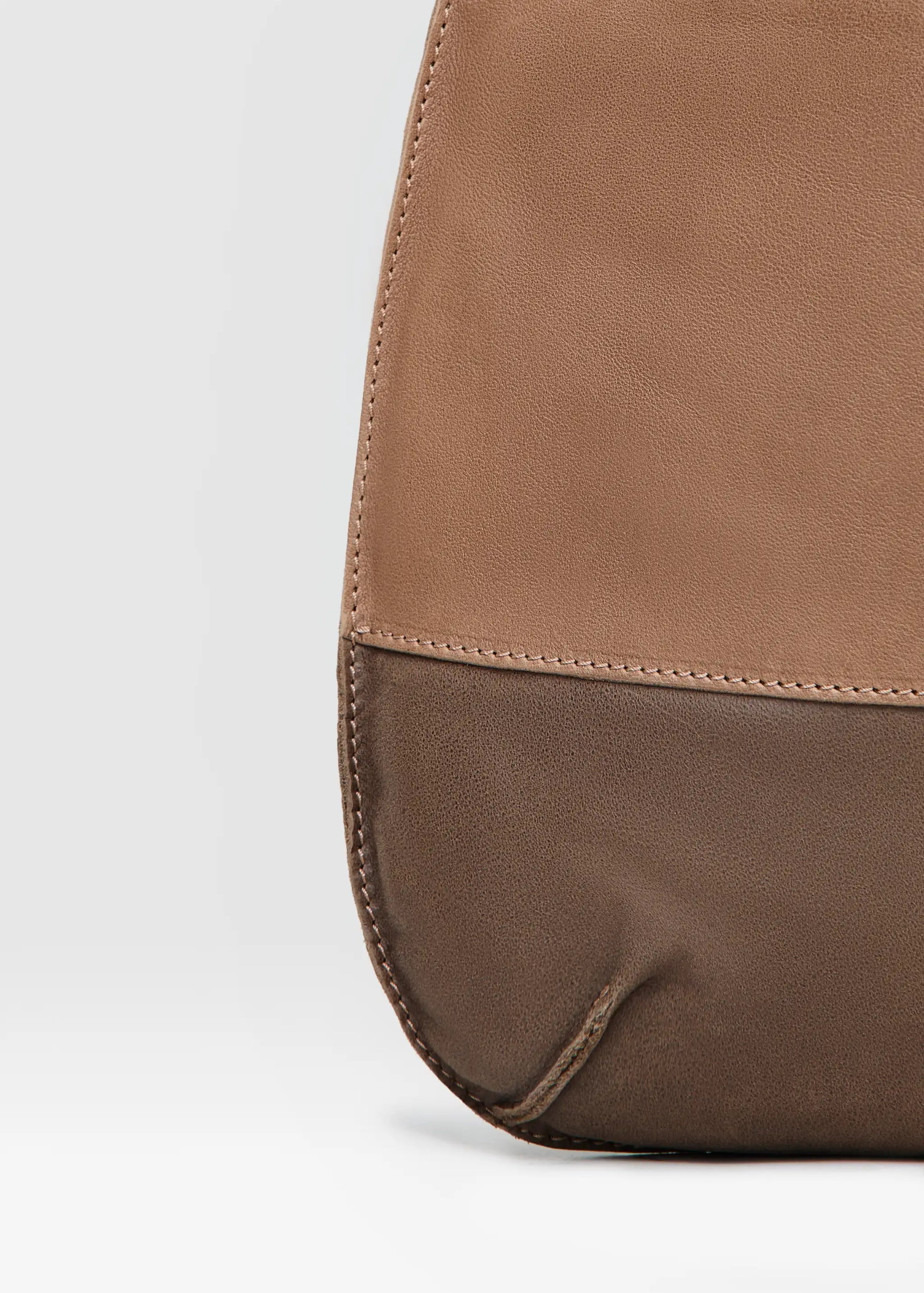 Close-up of the Philini Semfira Hobo Bag in soft brown nubuck and calf leather, focusing on the texture interplay, earth-toned straps, and detailed craftsmanship. Designed and luxury warm-toned suede-leather hobo