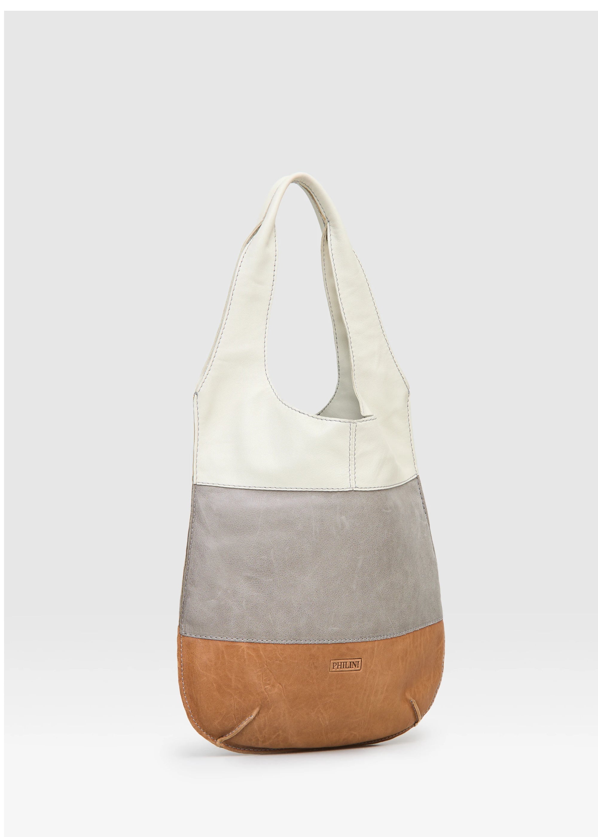 Side view of the Philini Semfira Hobo Bag in cognac wild calf leather, featuring three gentle-color straps, integrated handles, and a stamped logo. Sustainable luxury handbag