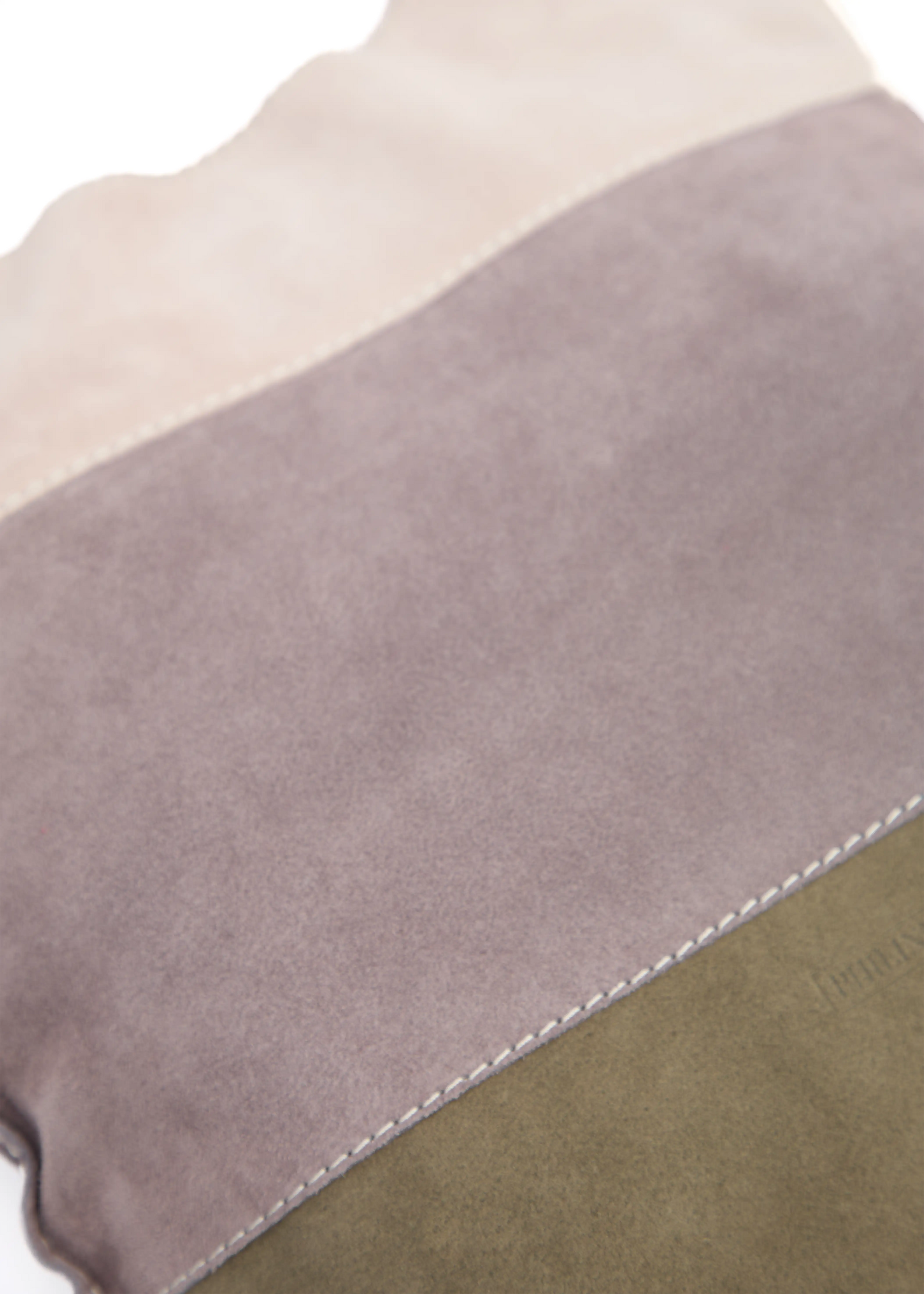 Close-up of the Philini Rose Hobo Bag Semfira in rose suede, showing the textured surface, tri-tone straps, and visible hand-stitched seams. Premium suede bag, handcrafted women’s accessory