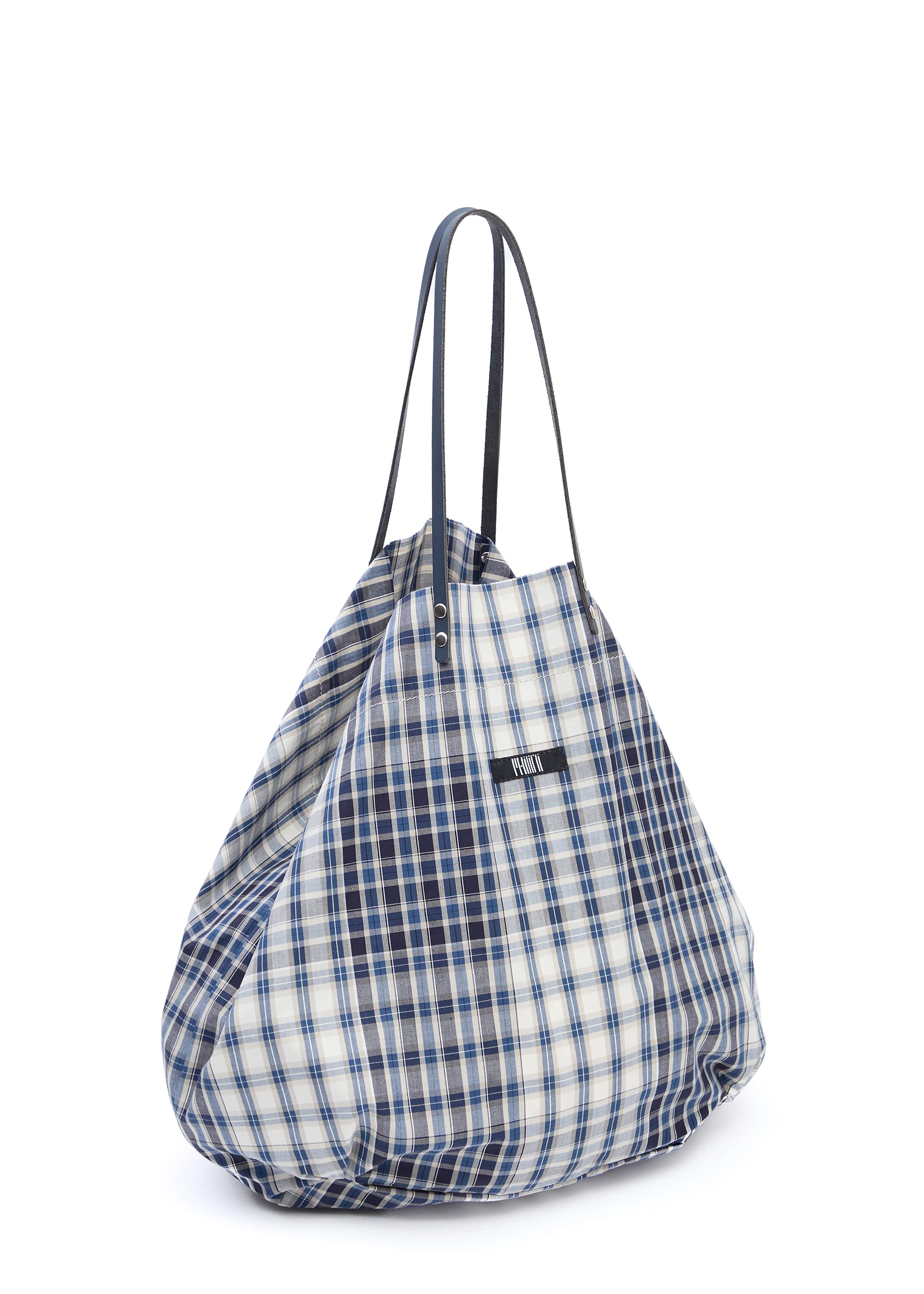 Side view of the Philini Blue Shopper in checkered cotton, featuring long calf leather handles with silver attachments, top button closure, and sewn fabric logo. Elegant, sustainable fabric shopper
