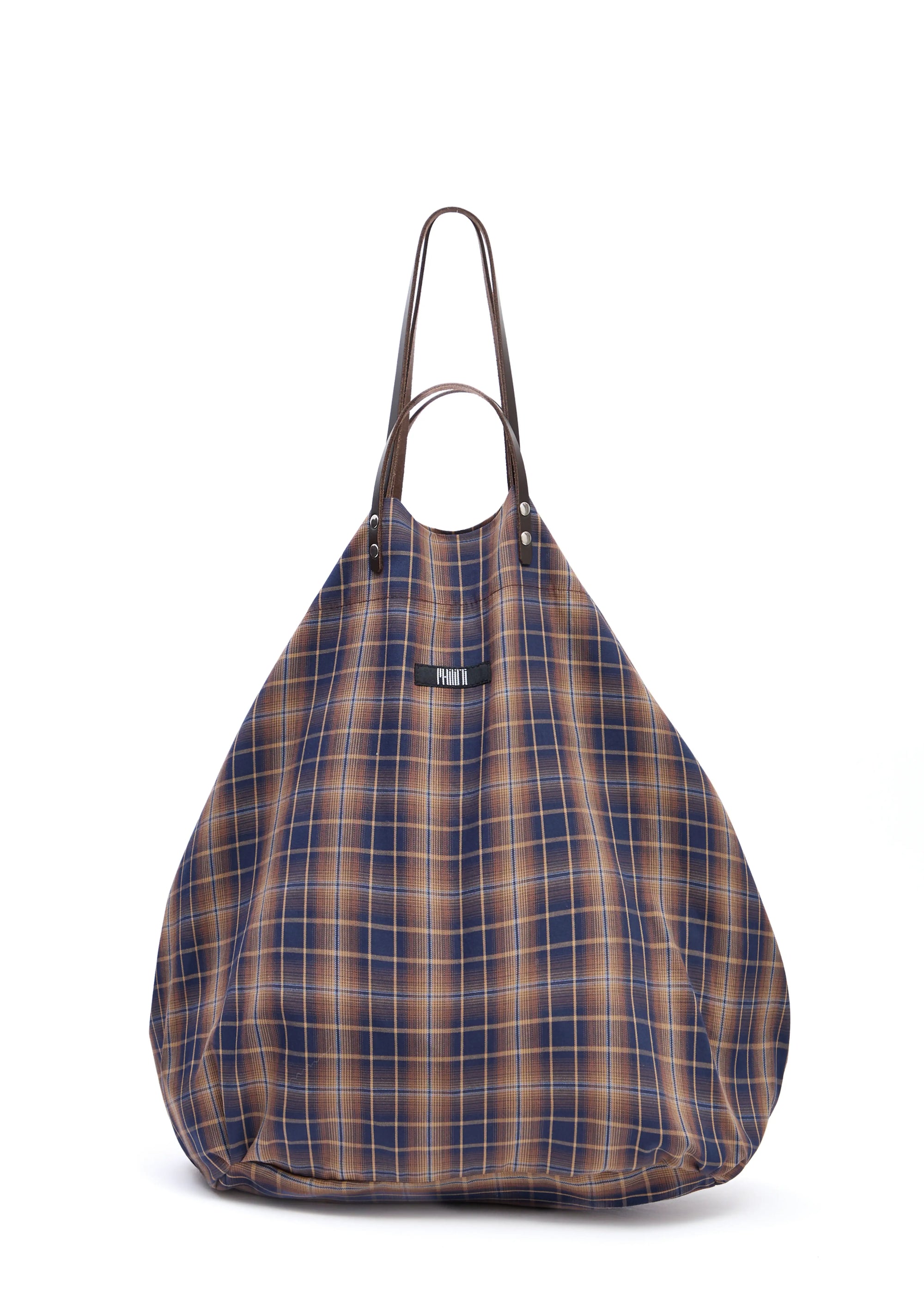 Front view of the Philini Shopper in checkered brown cotton, featuring short and long brown calf leather handles, top button closure, softly structured pear shape, and sewn fabric logo. Elegant and practical designer shopper