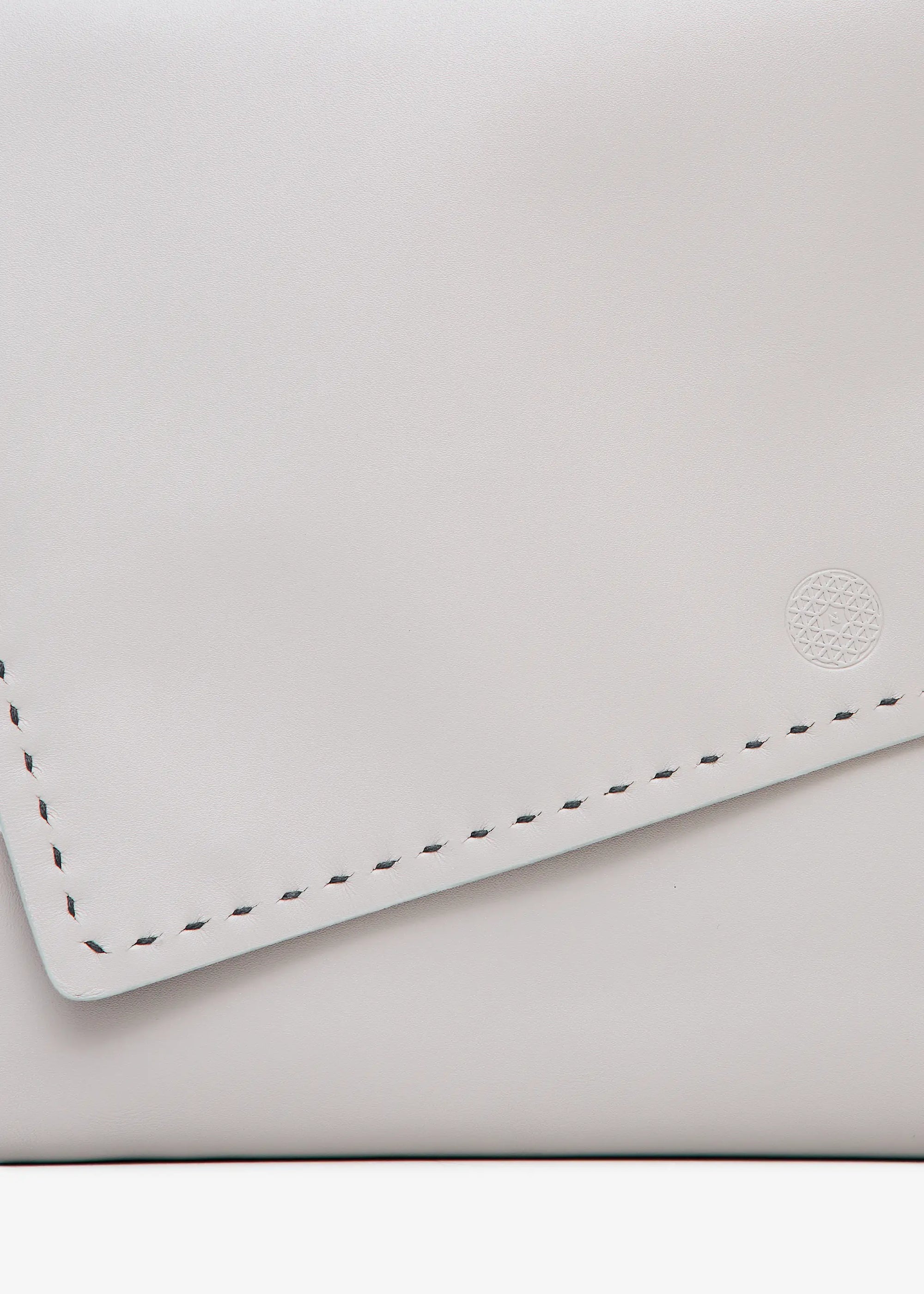 Close front view of the Philini Valery Business Clutch in taupe aniline nappa leather, slim rectangular shape, front flap slightly open with press studs and visible hand-stitched details.  Handcrafted leather accessory designed as an elegant leather case for work essentials