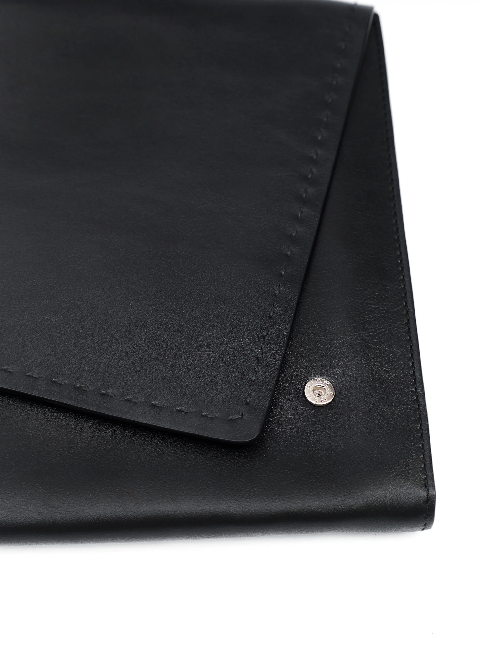 Close front view of the Philini Valery Business Clutch in black aniline calf leather, slim rectangular silhouette with partially open flap, visible press studs, and fine hand-stitching. Structured leather clutch ideal as a professional organizer bag