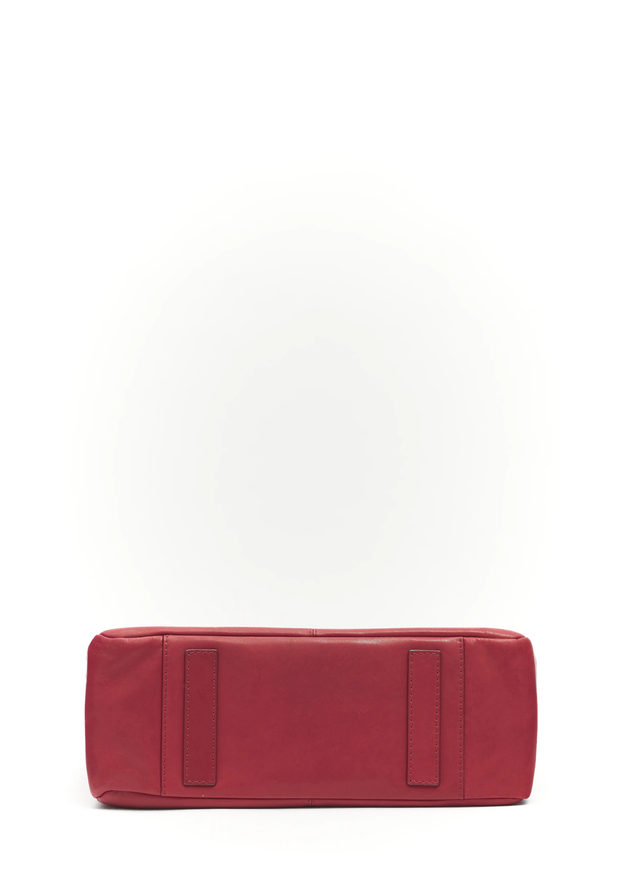 Bottom view of the Philini Elena Red Tote Bag in red aniline leather, featuring two small leather pads that serve as protective feet. This handcrafted tote embodies eco-conscious fashion and premium quality.