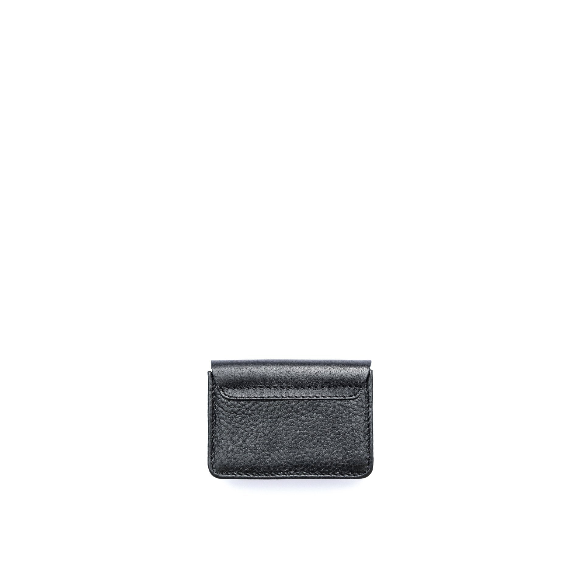 Back view of the Philini Lea Black Business Card Holder, showing seamless full-grain leather flap merging with buffalo leather base. A handcrafted, sustainable leather card wallet designed for business card organization